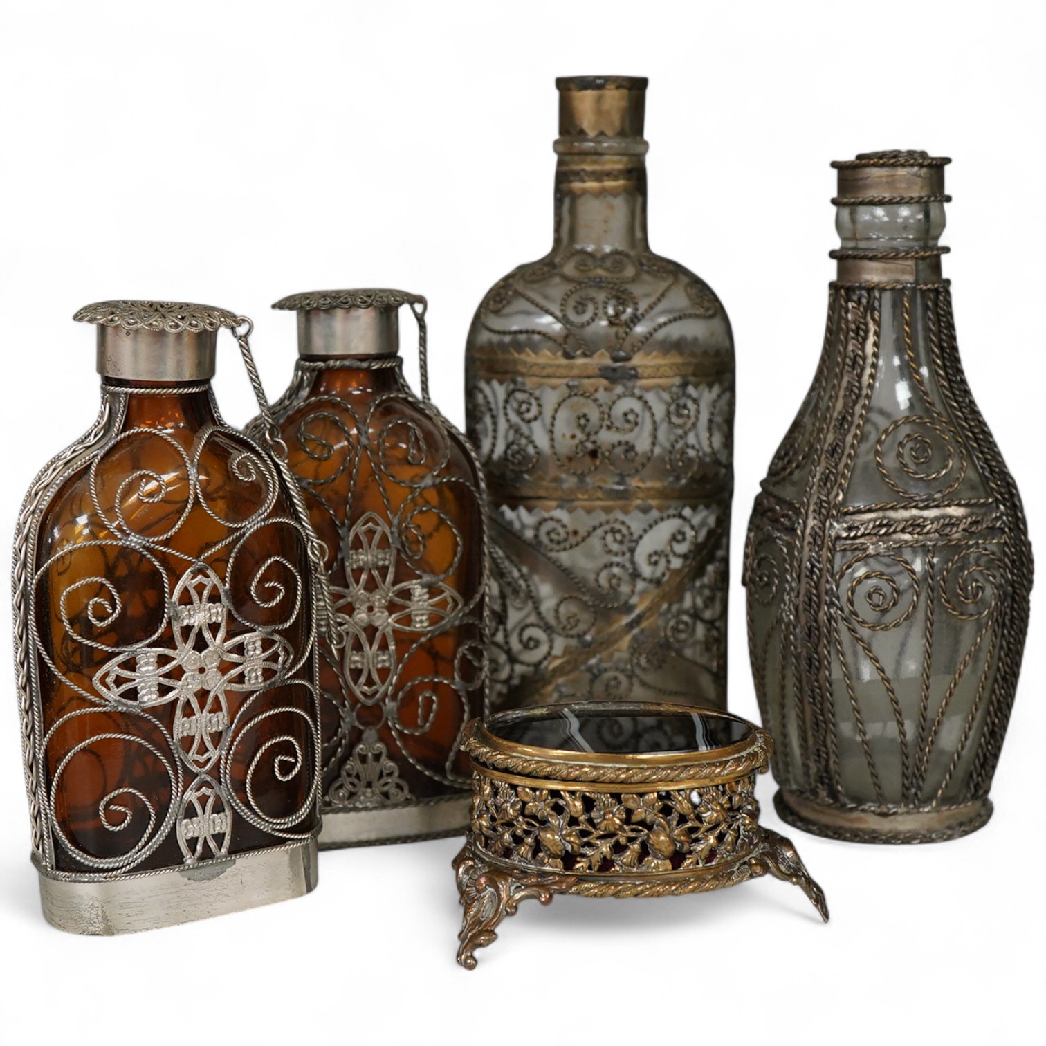 A collection of continental glass and wire worked bottles and flasks and a gilt metal onyx trinket box, tallest 19.5cm